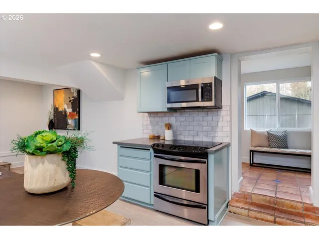 a kitchen with a sink and a microwave