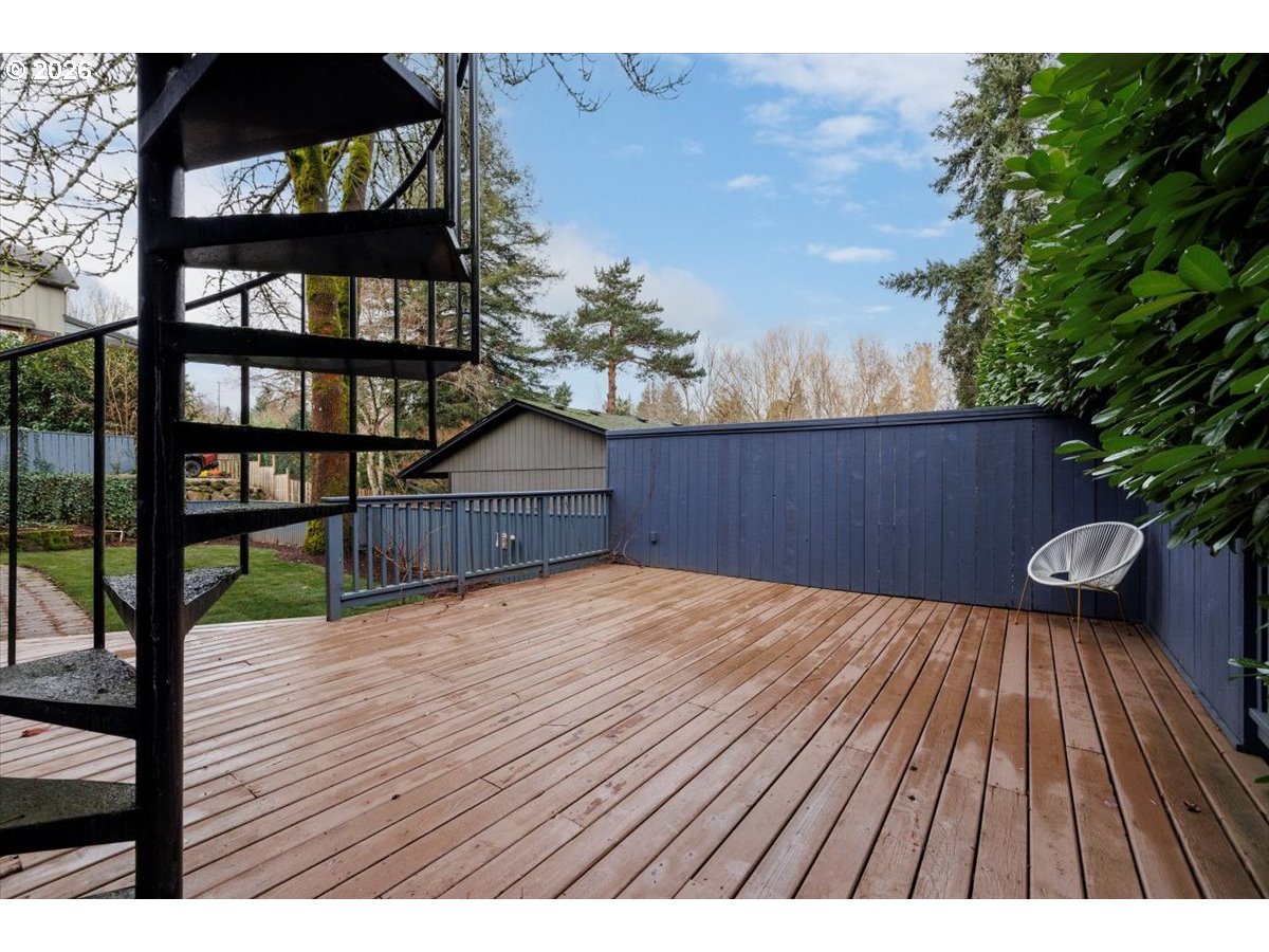 3827 Southwest Dolph Court Portland, OR 97219 - Photo 46 of 48 a view of backyard with a deck and wooden floor