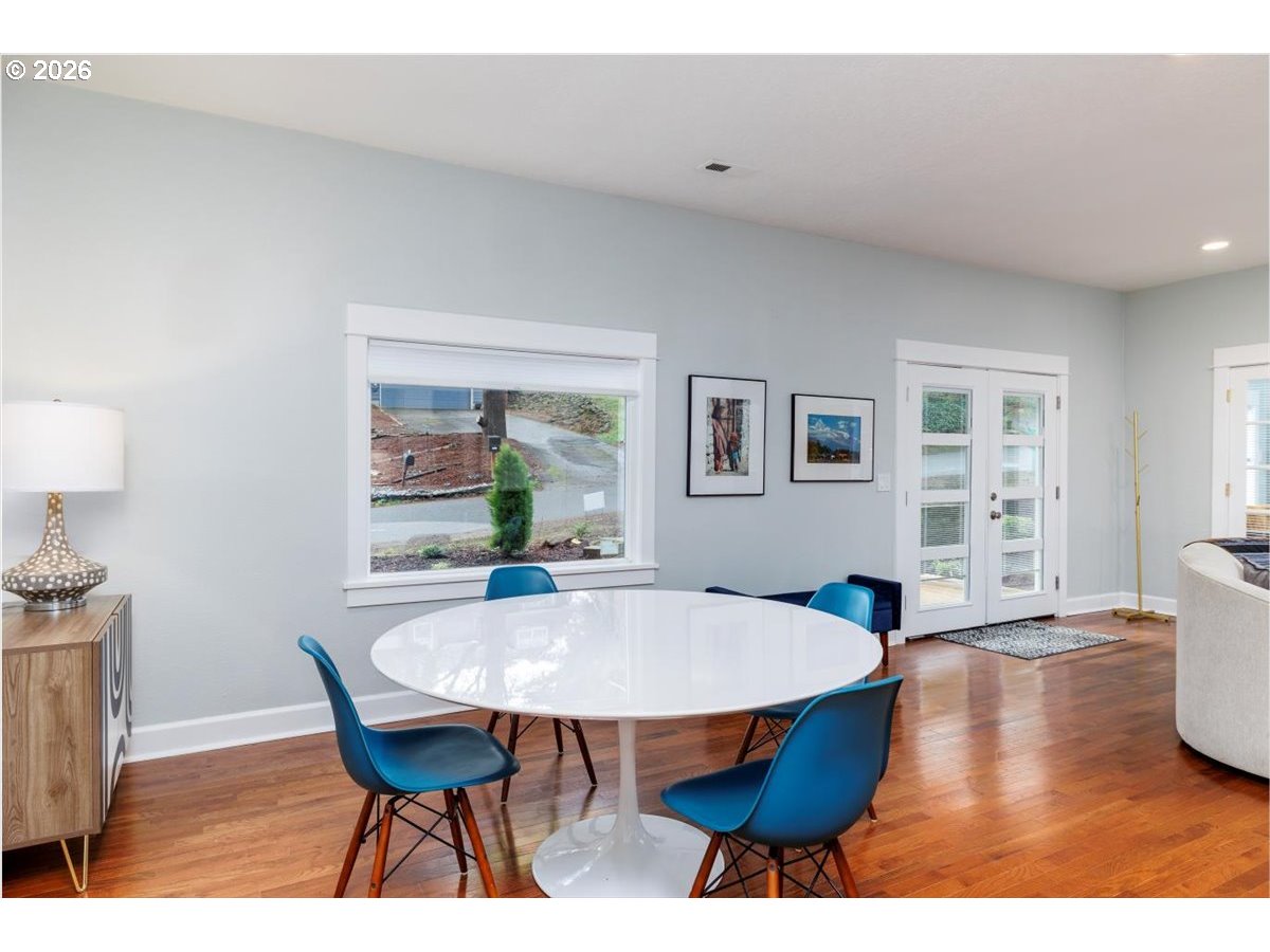 3827 Southwest Dolph Court Portland, OR 97219 - Photo 5 of 48 a view of a dining room with furniture and wooden floor