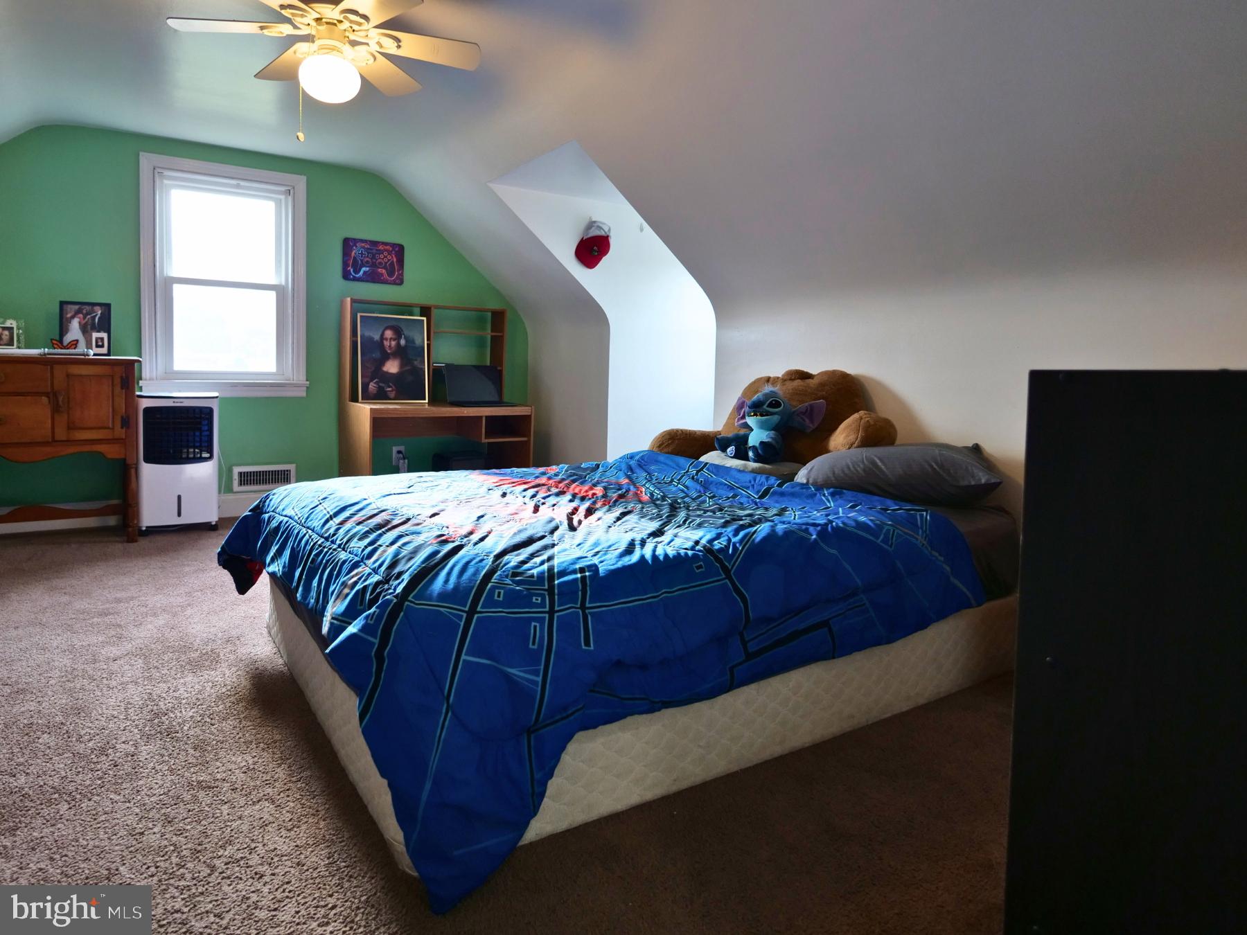120 Harrison Street Emmaus, PA 18049 - Photo 13 of 20 a bedroom with a bed and a chandelier