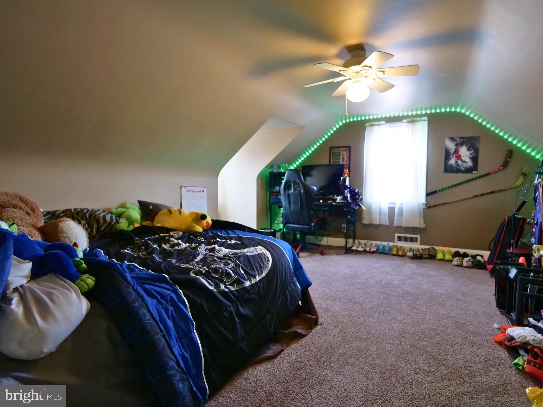 120 Harrison Street Emmaus, PA 18049 - Photo 14 of 20 a bedroom with bed and a chandelier