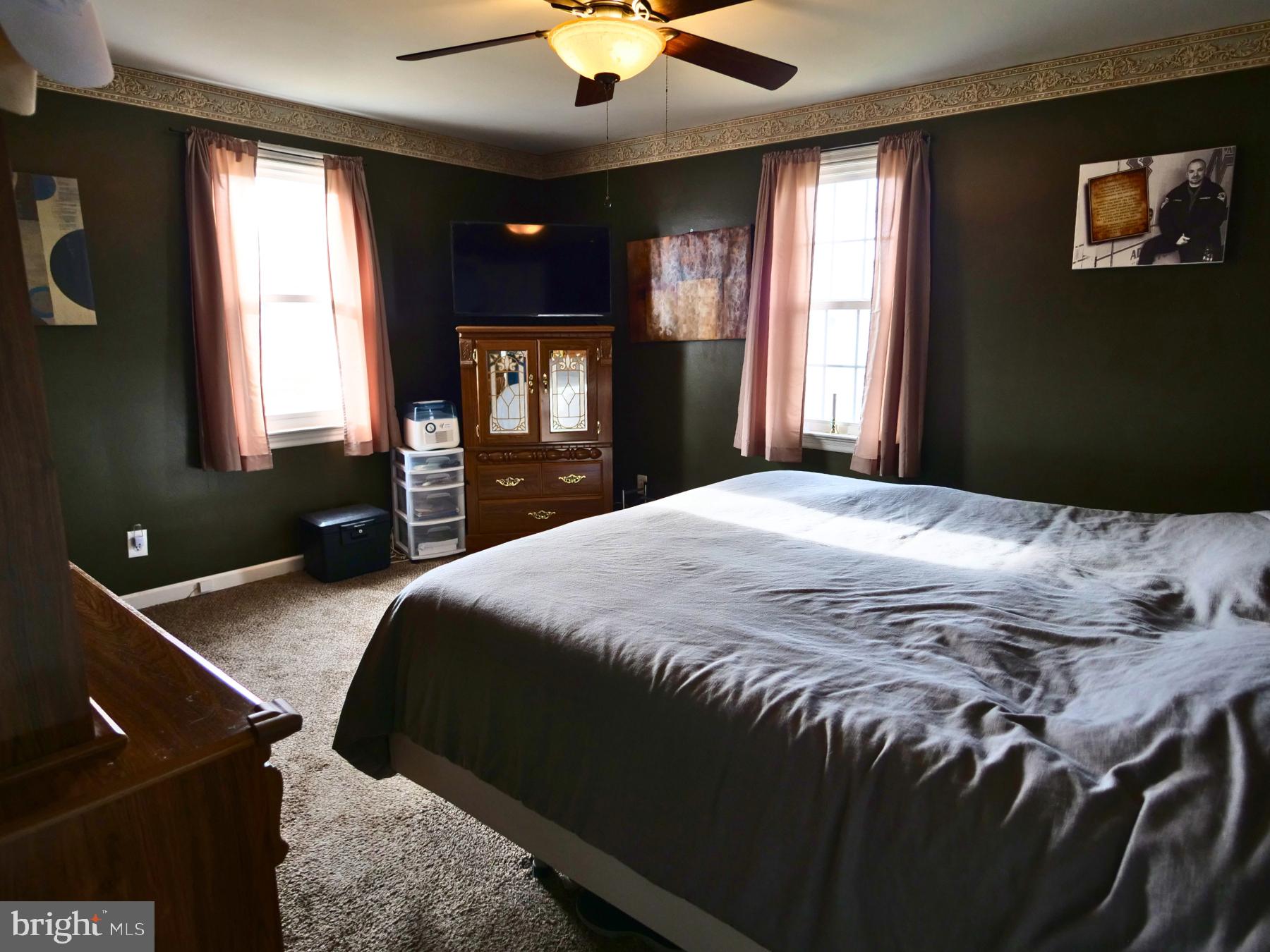 120 Harrison Street Emmaus, PA 18049 - Photo 15 of 20 a bedroom with a bed and a chandelier
