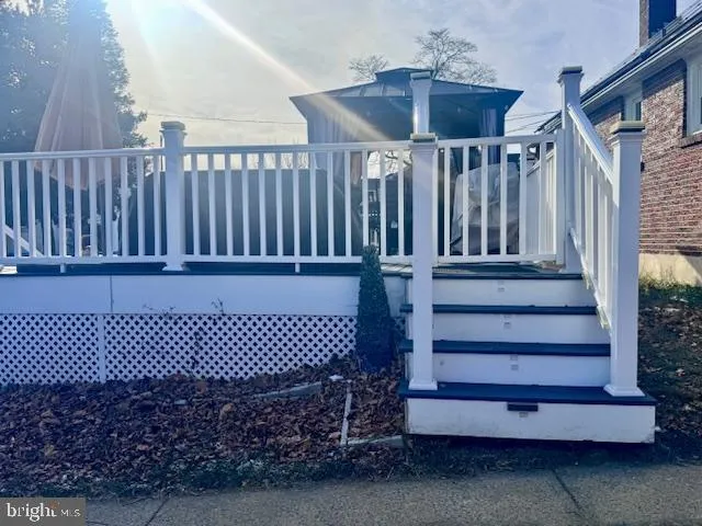 a view of a backyard with wooden fence