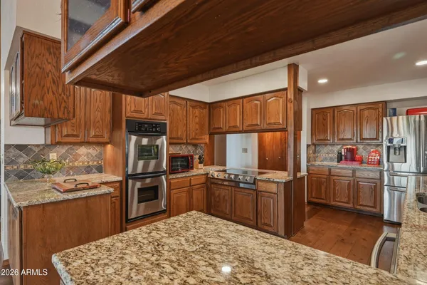 a kitchen with granite countertop lots of counter top space