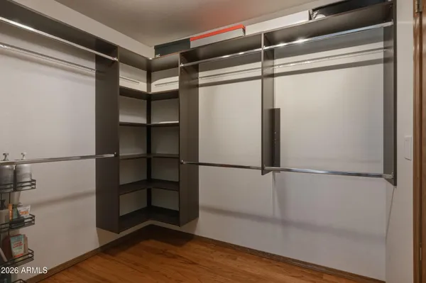 a spacious bedroom with a bed and a window