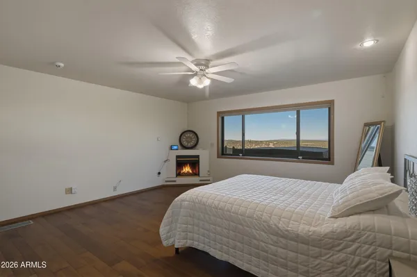 a view of a balcony with furniture and hardwood