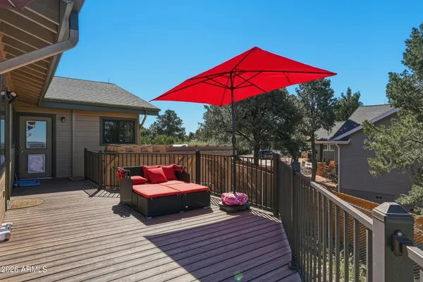 a bathroom with a granite countertop sink a toilet and mirror