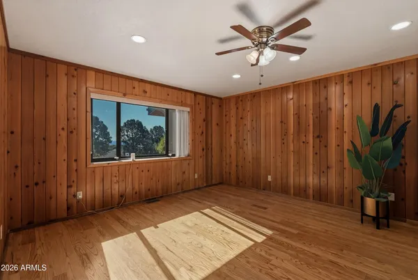a view of livingroom with hardwood floor and ceiling fan