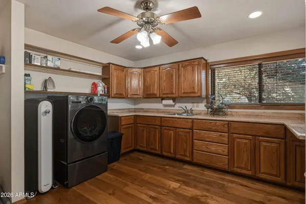 a view of a room with stairs and a ceiling fan