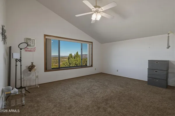 a view of a city with lush green forest