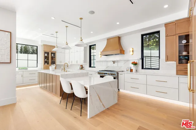 a view of a workspace with furniture and window