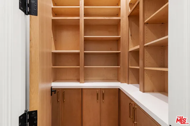 a bed room with two beds and a potted plant