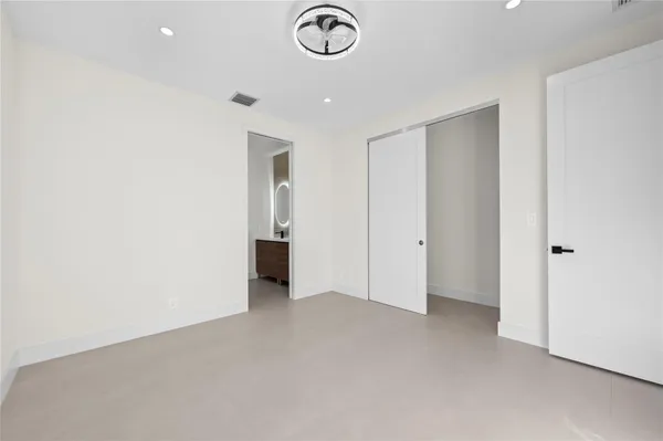 a bathroom with a double vanity sink mirror and toilet