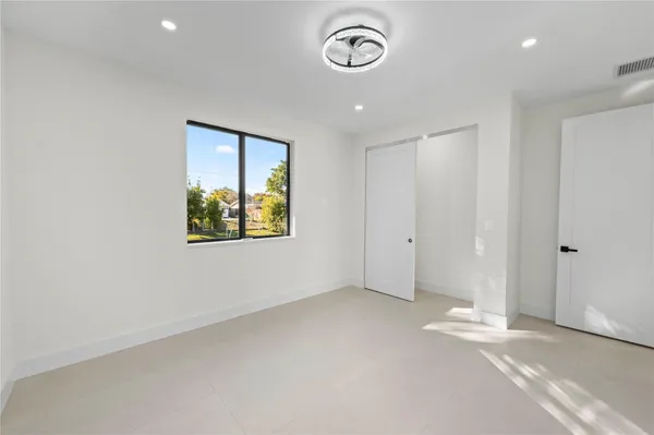 a view of an empty room with a window