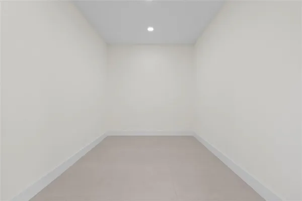 a bathroom with a bathtub sink and mirror