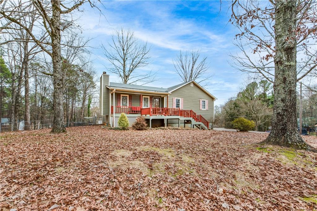 2667 Marble Quarry Road Canton, GA 30114 - Photo 1 of 1 a view of a house with a yard covered in snow