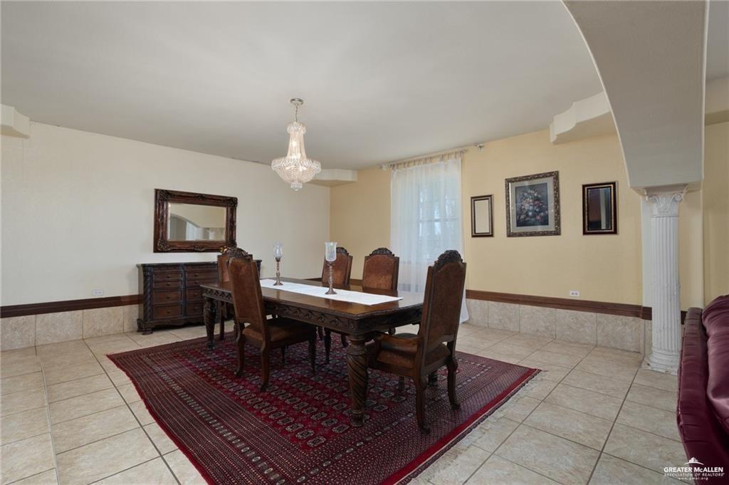 4523 South Tower Road Edinburg, TX 78542 - Photo 12 of 32 a view of a dining room with furniture