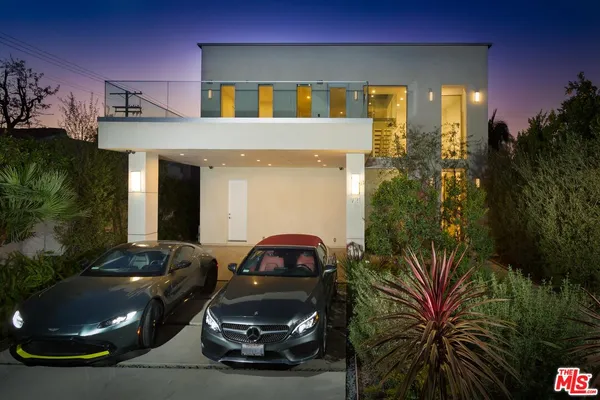 a car parked in front of a house