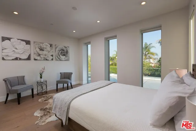 a bedroom with a bed and a couch