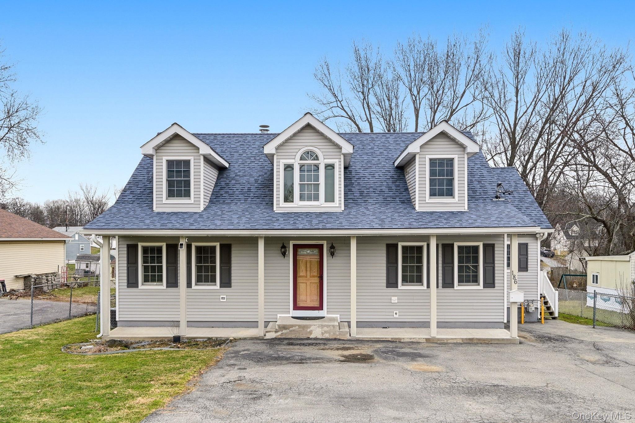 186 Violet Avenue Poughkeepsie, NY 12601 - Photo 1 of 50 a front view of a house with a garden