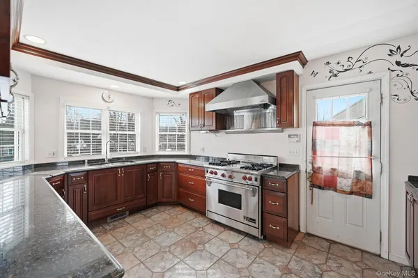 a kitchen with a stove a sink and a refrigerator