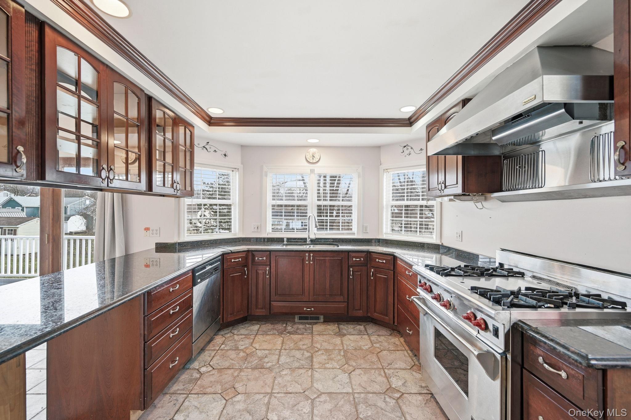 186 Violet Avenue Poughkeepsie, NY 12601 - Photo 13 of 50 a large kitchen with stainless steel appliances granite countertop a stove and a sink