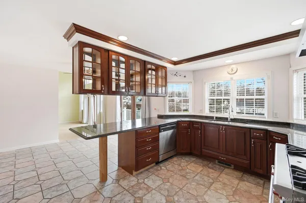 a kitchen with stainless steel appliances granite countertop a stove and a sink