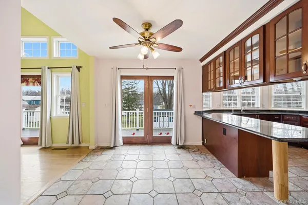 a very nice looking room with a large window and chandelier