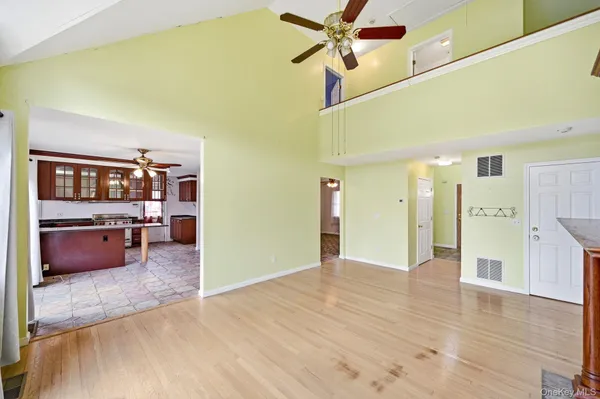 a view of a kitchen and a cabinet a fireplace
