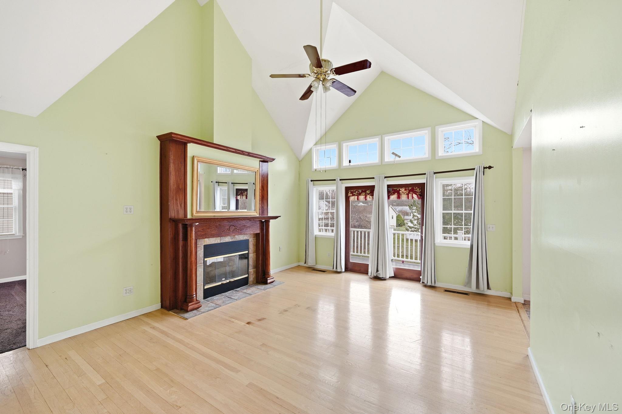 186 Violet Avenue Poughkeepsie, NY 12601 - Photo 23 of 50 a view of an empty room with a fireplace and a window