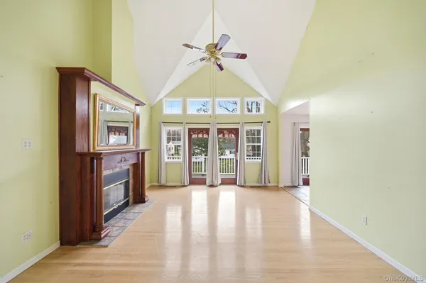 a view of an entryway with wooden floor