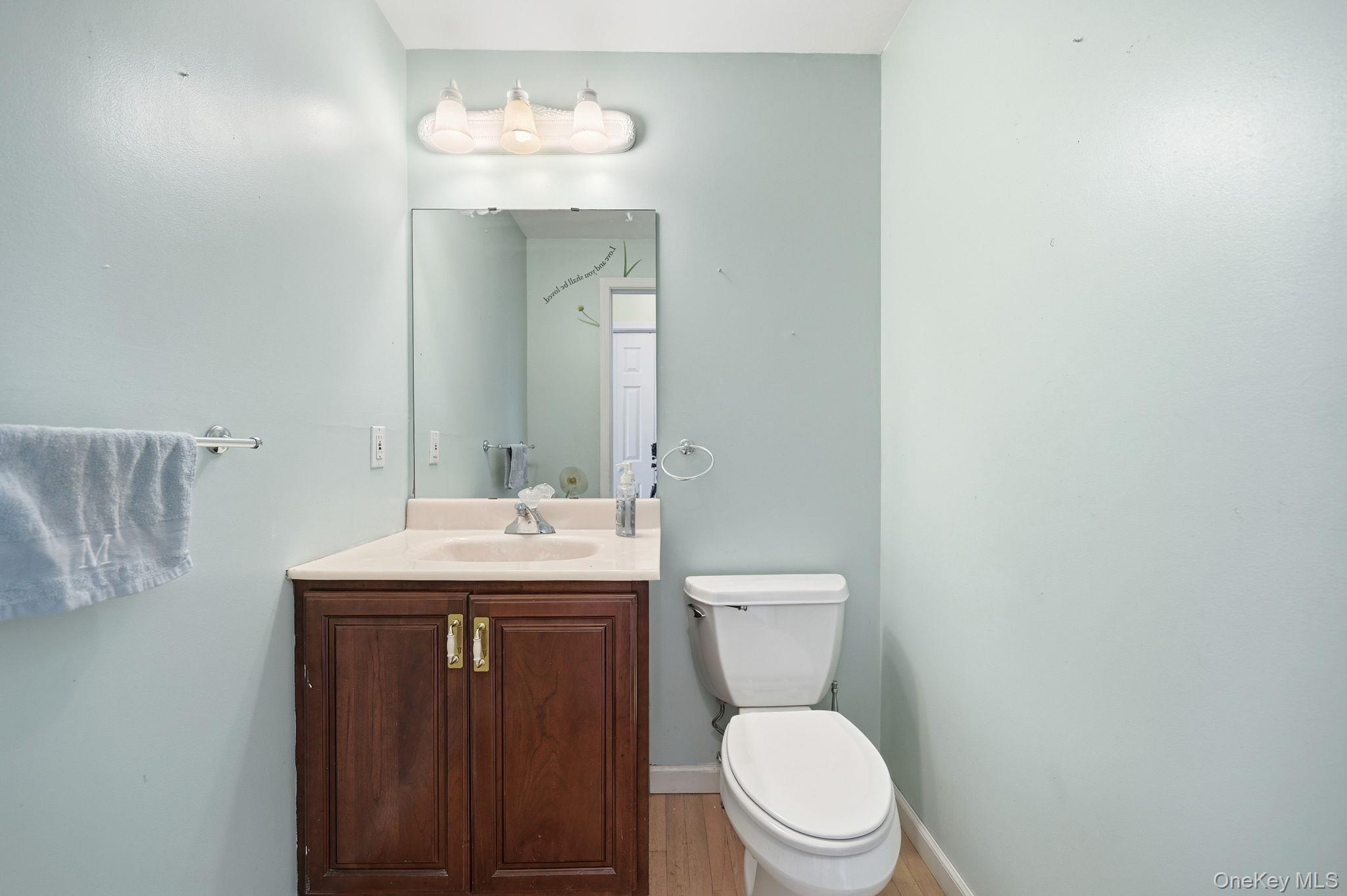 186 Violet Avenue Poughkeepsie, NY 12601 - Photo 27 of 50 a bathroom with a toilet a sink and mirror