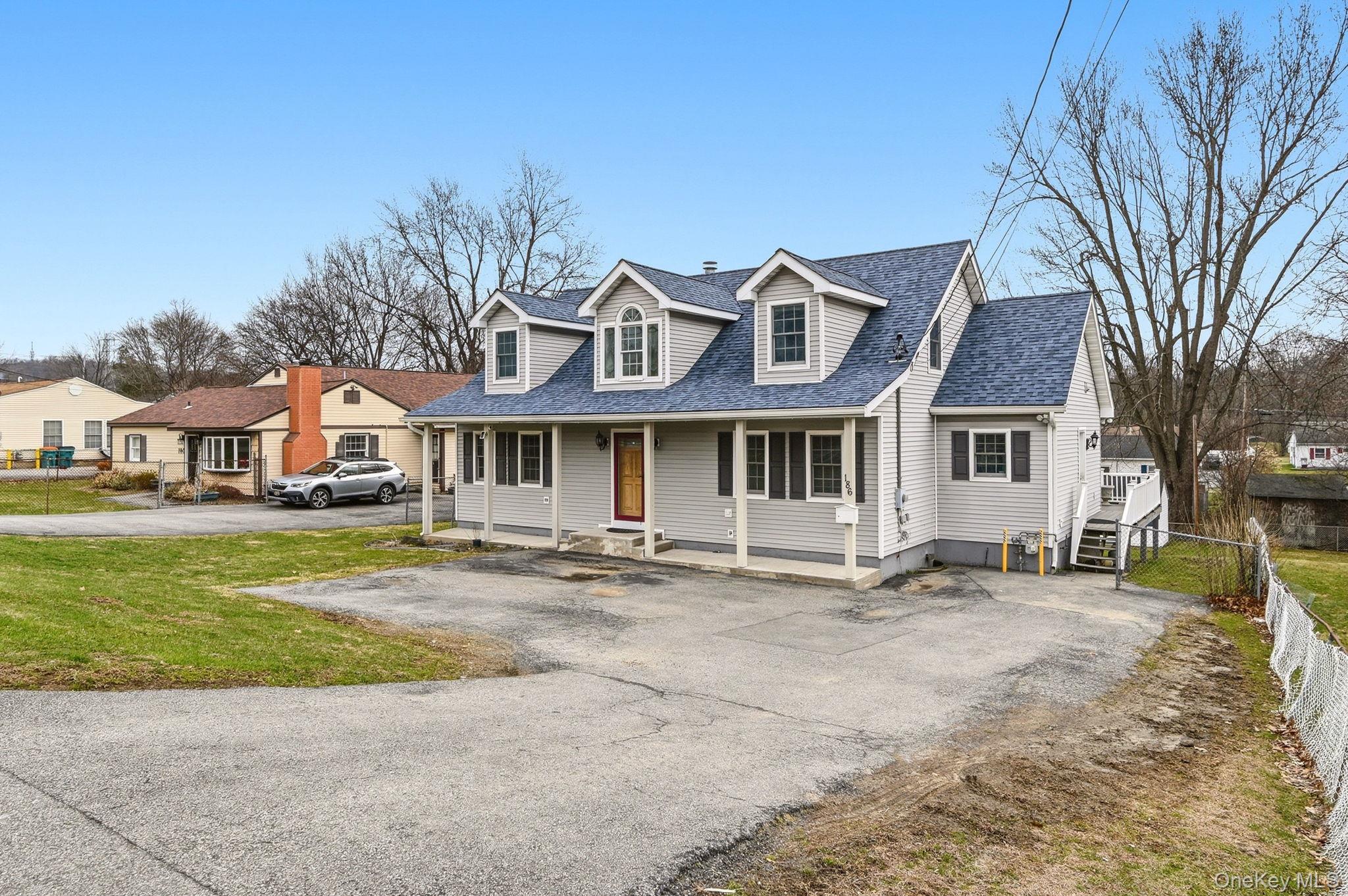 186 Violet Avenue Poughkeepsie, NY 12601 - Photo 3 of 50 a front view of a house with a garden and pathway