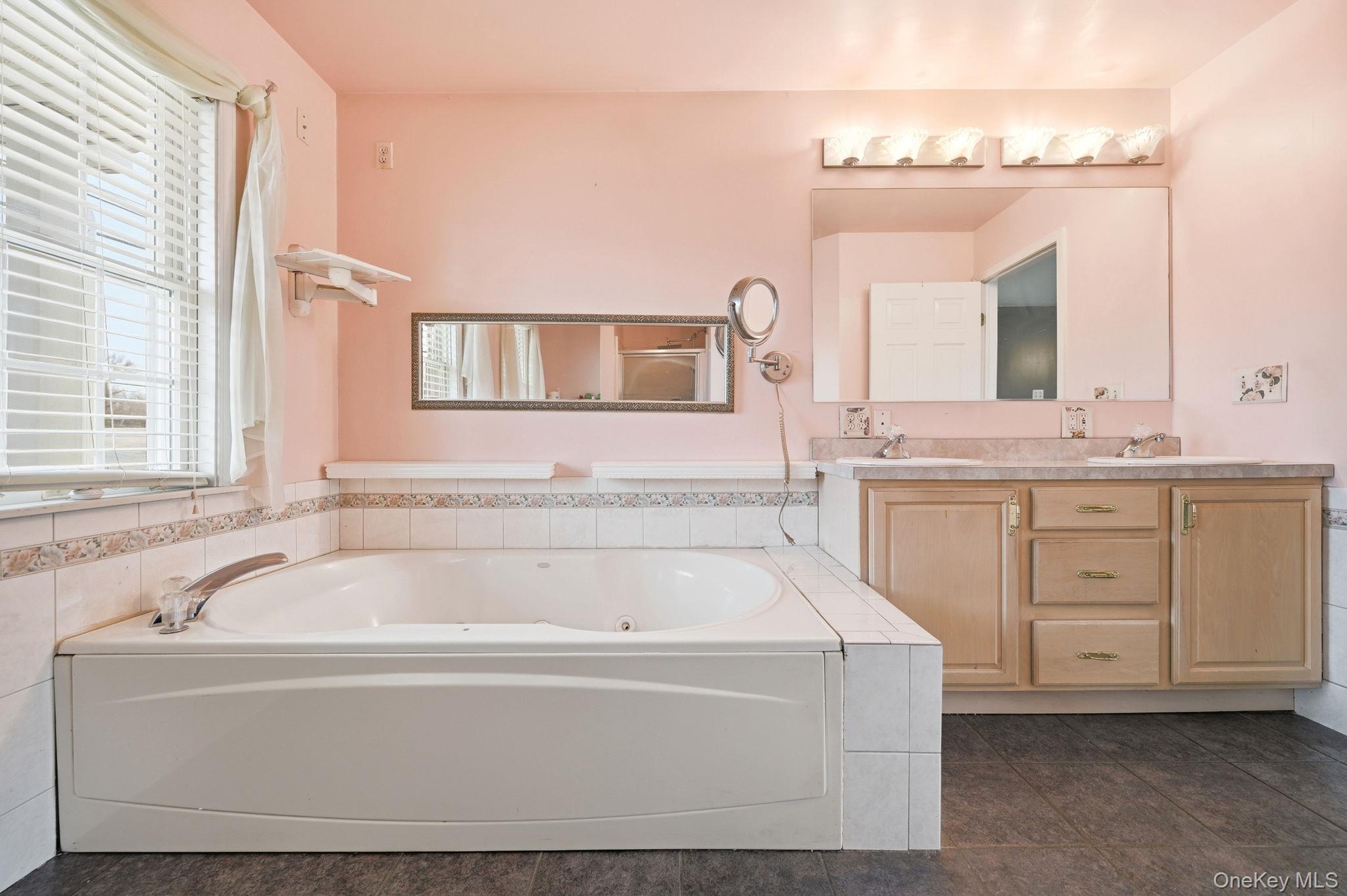 186 Violet Avenue Poughkeepsie, NY 12601 - Photo 34 of 50 a spacious bathroom with a bathtub and a sink
