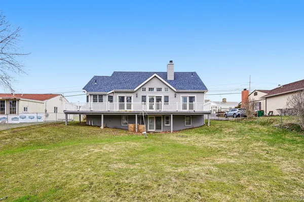 a view of a large body of water with a building in the background