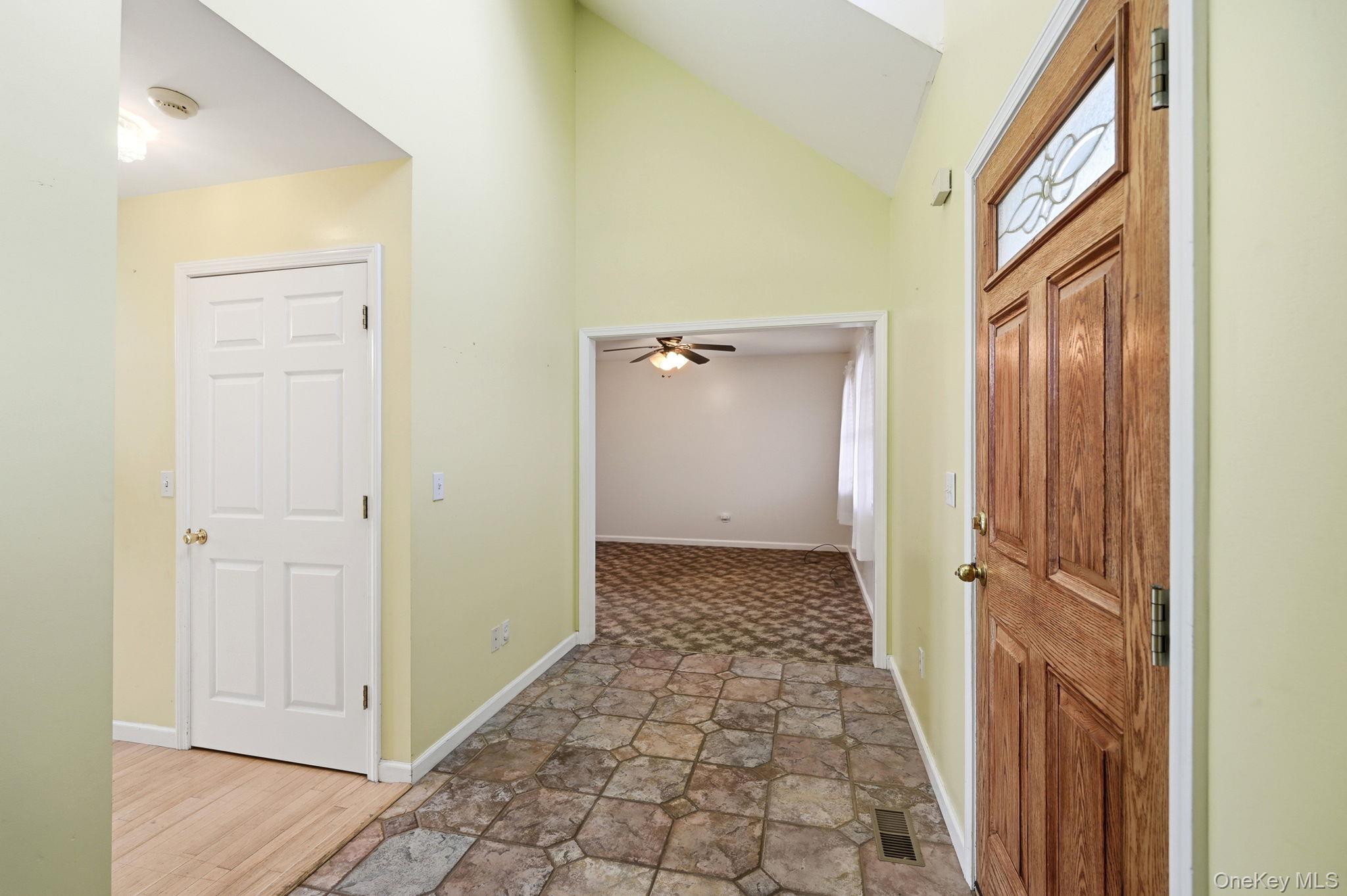 186 Violet Avenue Poughkeepsie, NY 12601 - Photo 8 of 50 a view of a hallway with wooden floor and a bathroom