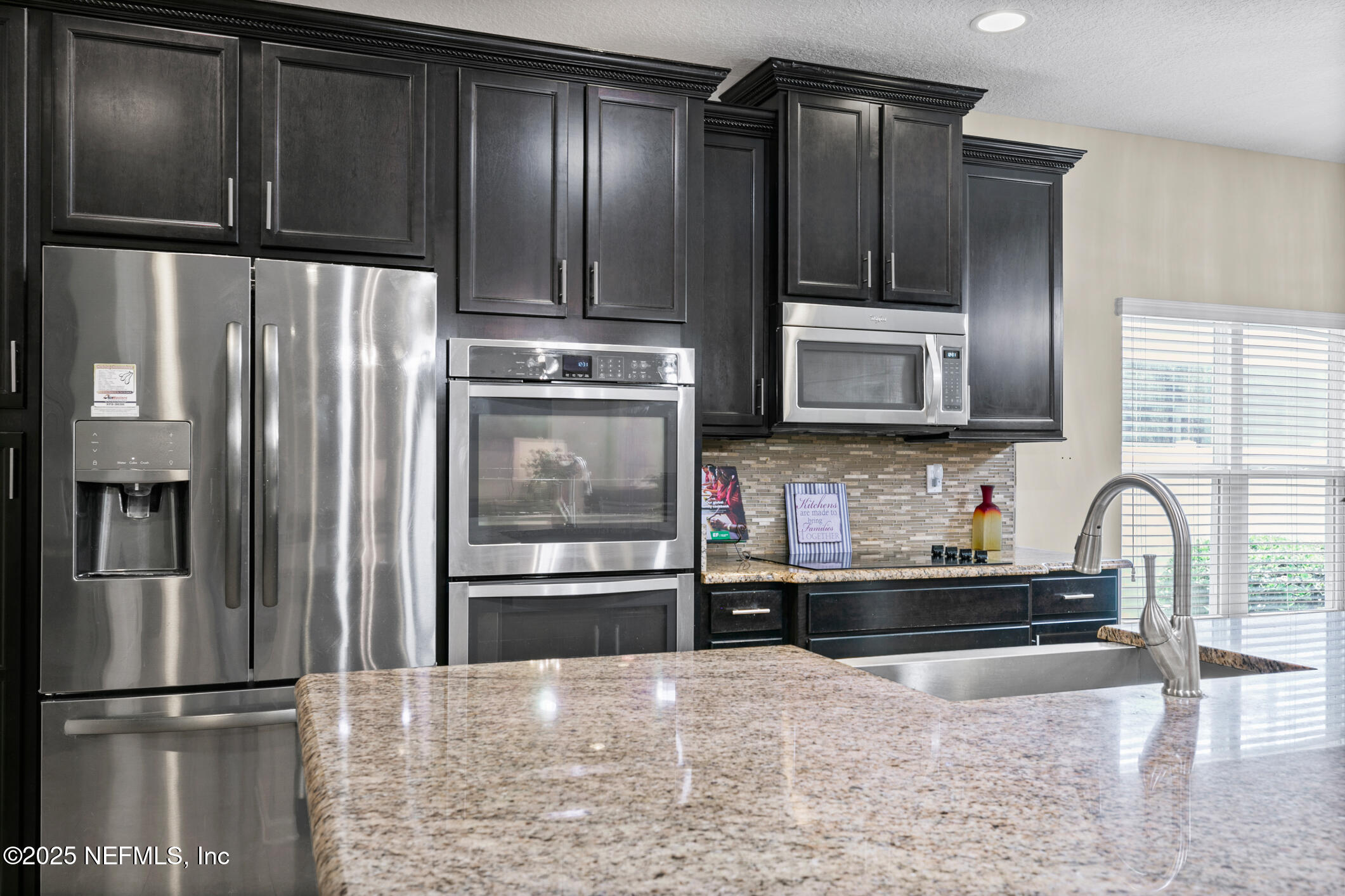 200 Ellsworth Circle St. Johns, FL 32259 - Photo 12 of 48 a kitchen with granite countertop stainless steel appliances and refrigerator
