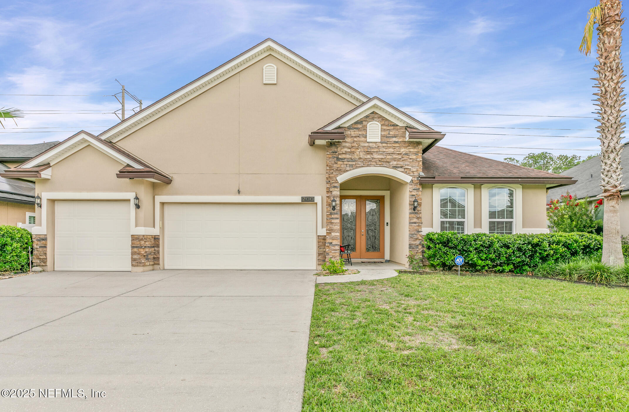 200 Ellsworth Circle St. Johns, FL 32259 - Photo 2 of 48 a view of a white house with a small yard and plants