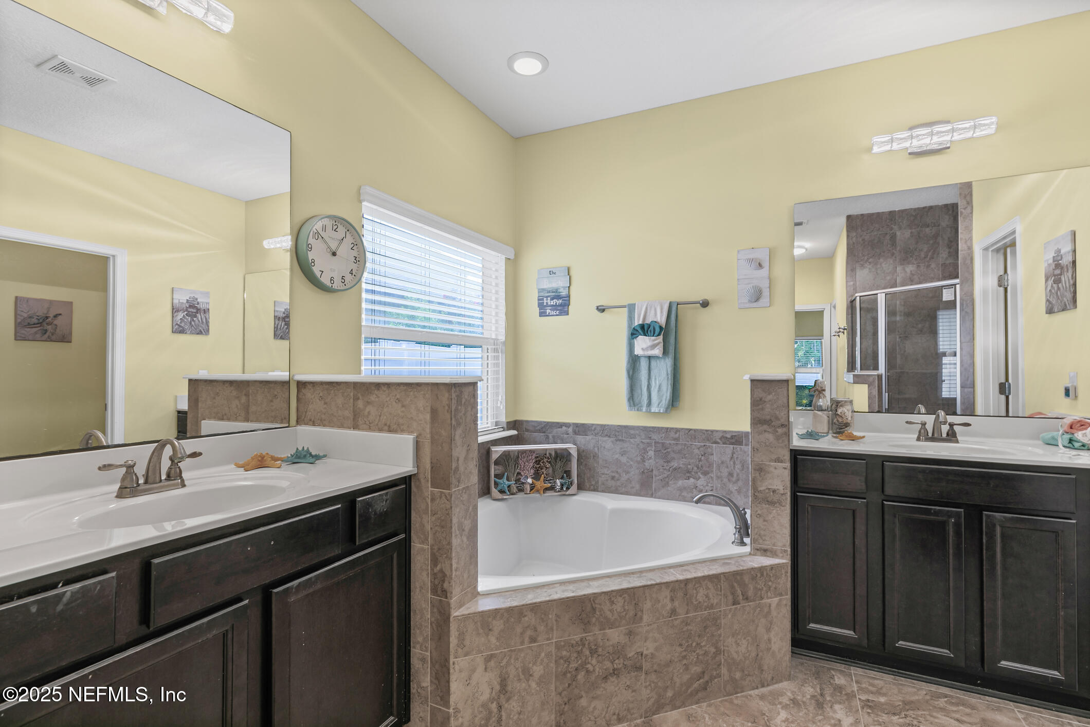 200 Ellsworth Circle St. Johns, FL 32259 - Photo 33 of 48 a bathroom with a bathtub double sink and mirror