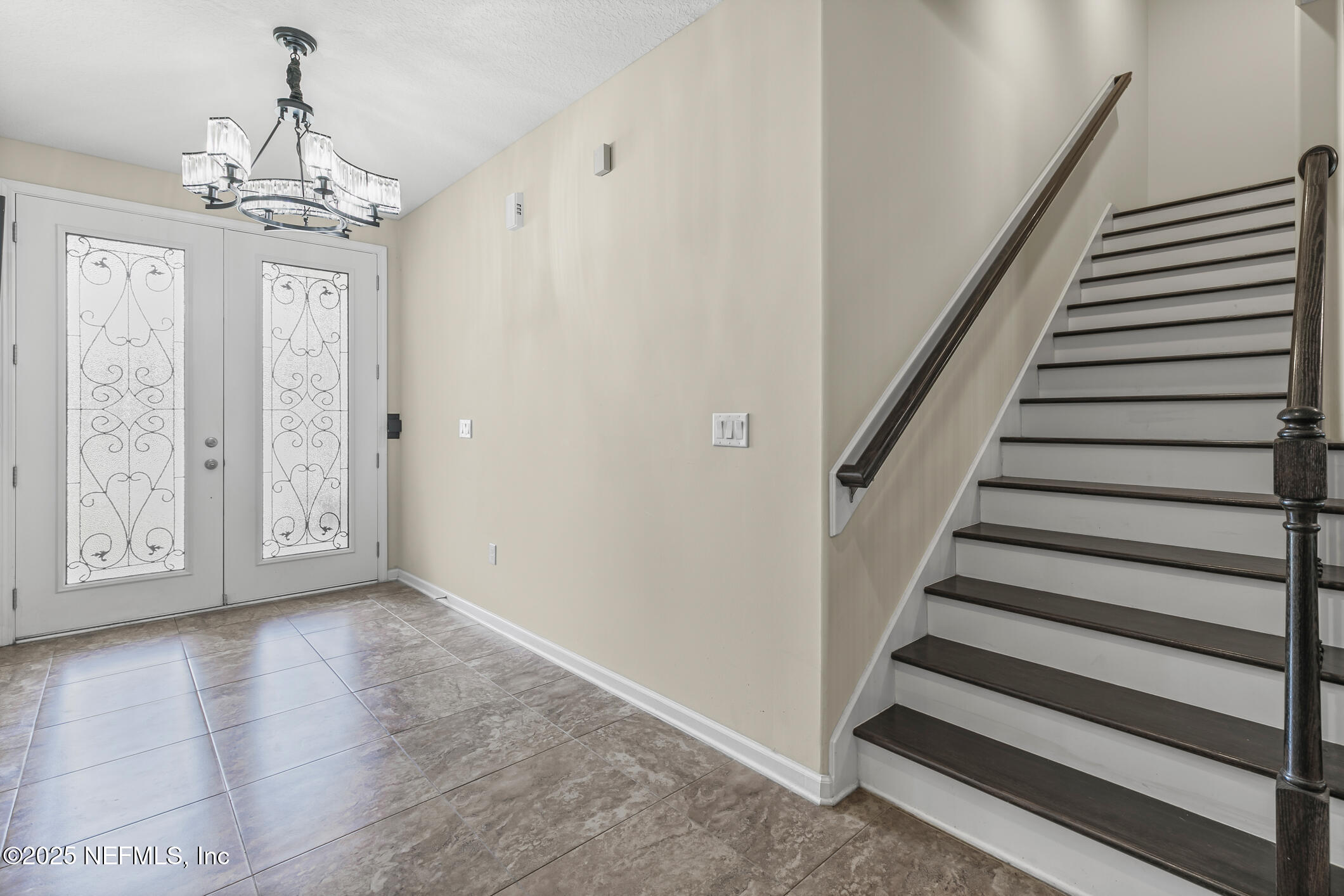 200 Ellsworth Circle St. Johns, FL 32259 - Photo 6 of 48 a view of a hallway with wooden floor and staircase