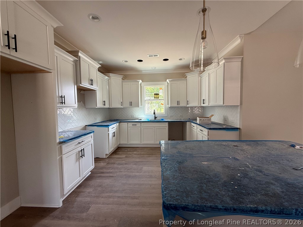 132 Ridge Stone Drive Autryville, NC 28318 - Photo 7 of 26 a large kitchen with cabinets
