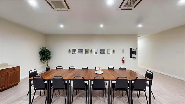 a view of a dining room with furniture and chandelier