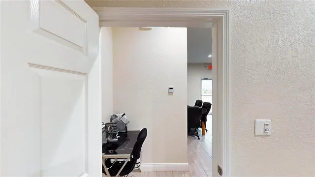 a view of a hallway with workspace