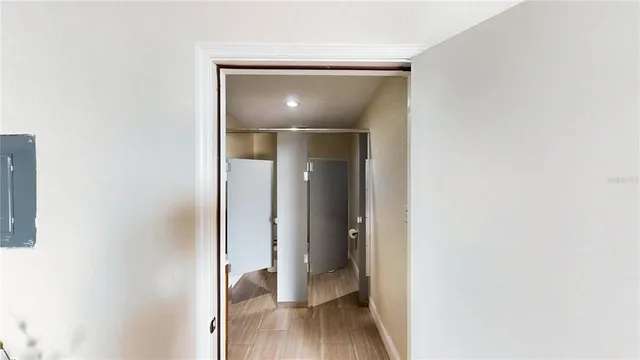 a view of a room with wooden floor