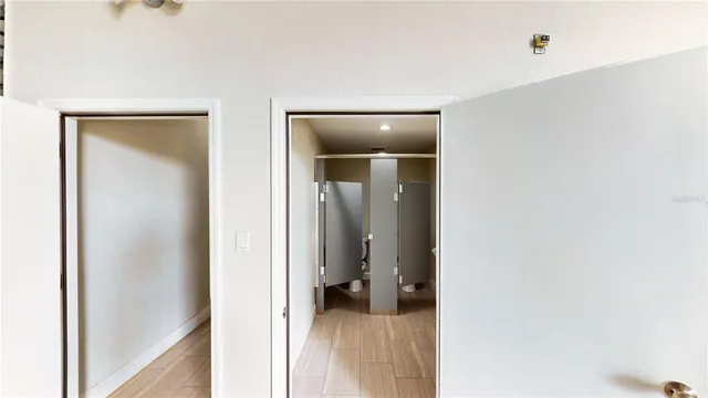 a view of a bedroom from a hallway