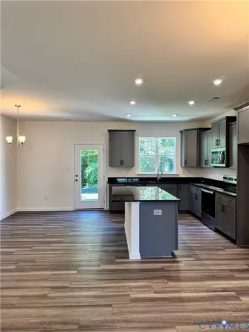 an empty room with wooden floor