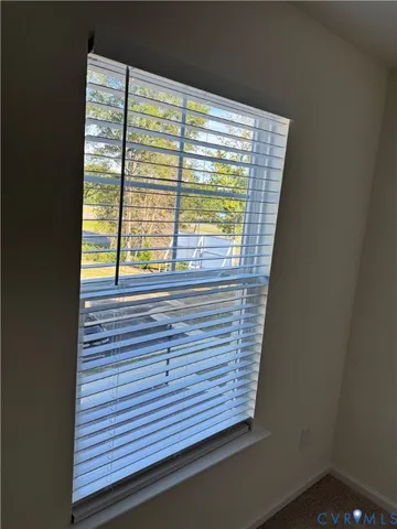 a view of a room that has a window