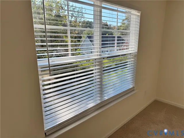 a view of an empty room and entryway