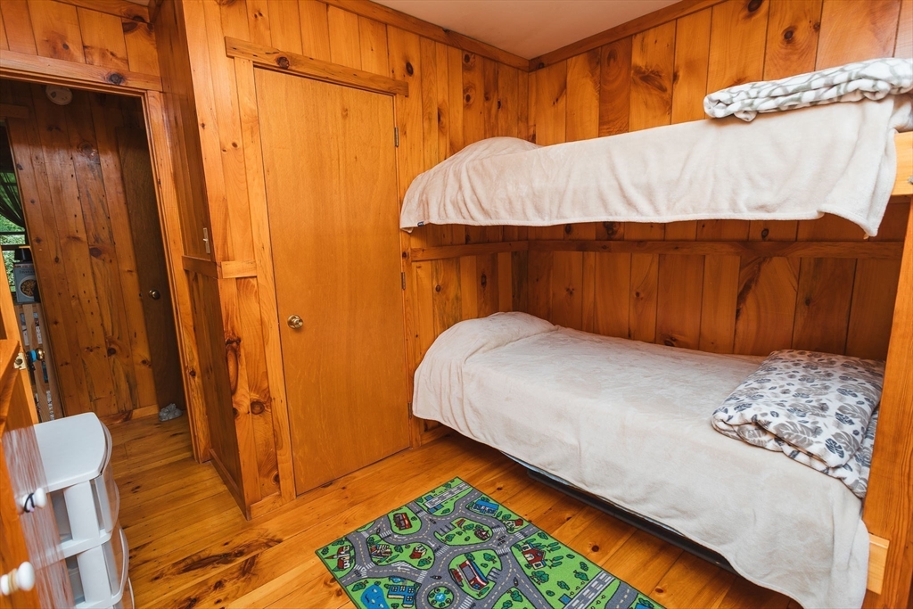 90 West Hawley Road Hawley, MA 01339 - Photo 20 of 34 a bedroom with a bed and a table