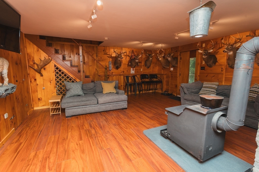 90 West Hawley Road Hawley, MA 01339 - Photo 24 of 34 a living room with furniture and wooden floor